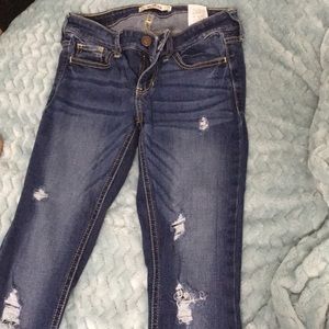 Ripped dark wash skinny jeans
